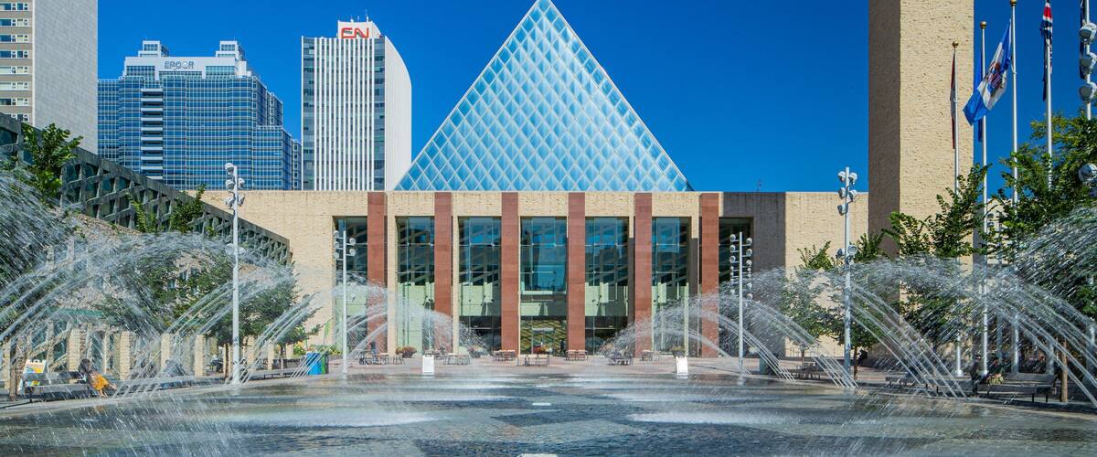 Edmonton City Hall which includes modern architecture, a city and a fountain