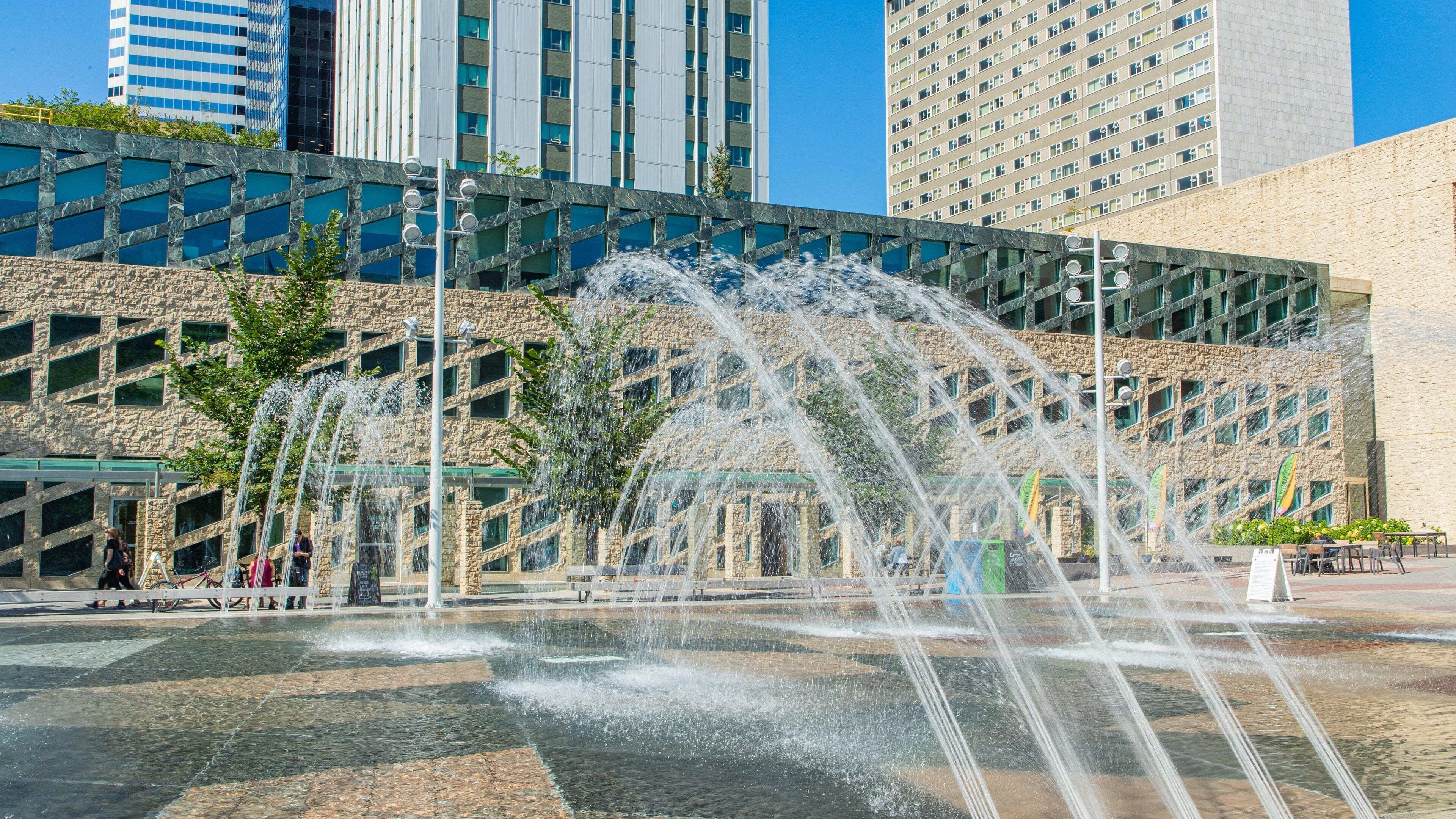 Edmonton City Hall featuring a square or plaza and a fountain