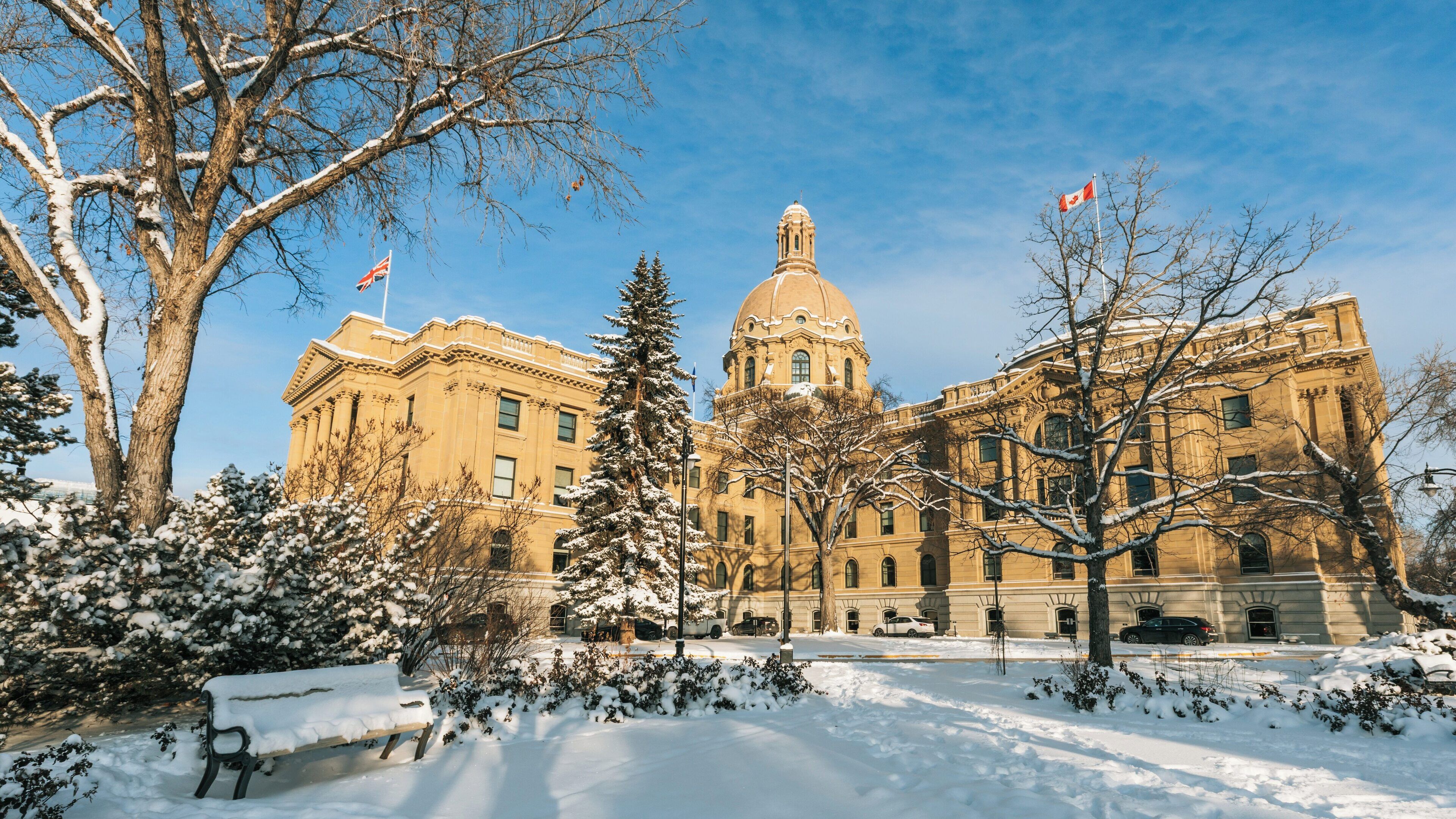 Snow-covered Alberta Legislature Building in North Central Edmonton surrounded by winter scenery