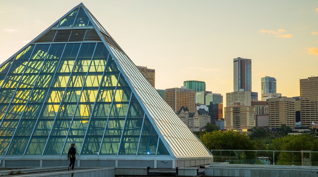 Muttart Conservatory featuring a sunset, a city and modern architecture
