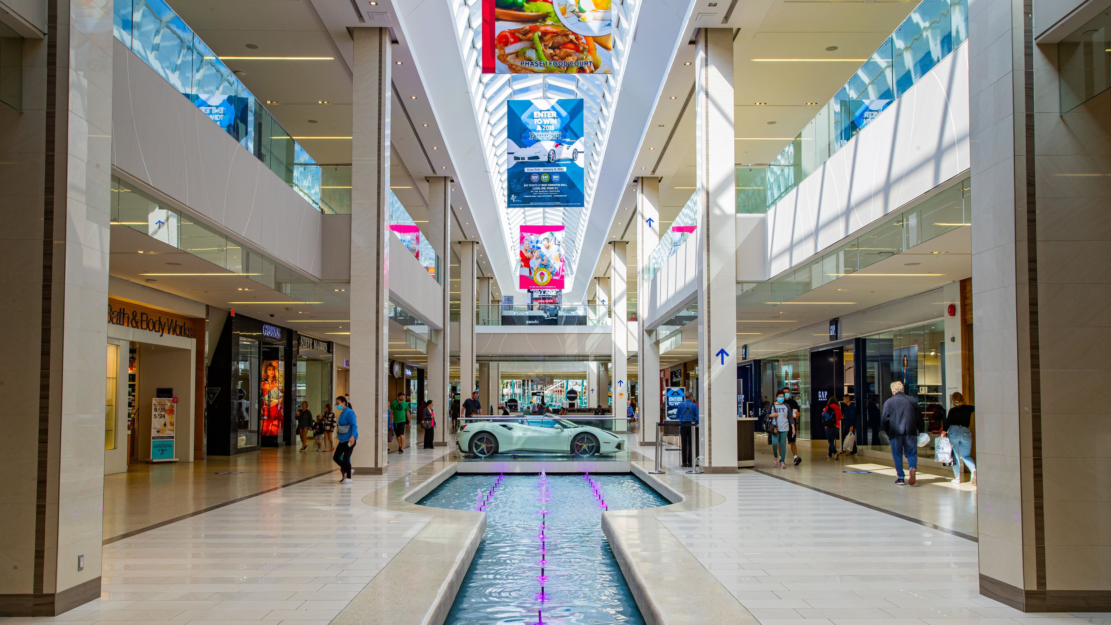 West Edmonton Mall which includes interior views, shopping and a fountain