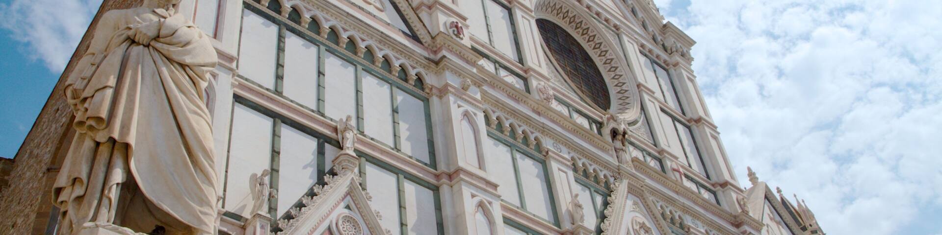 A grand cathedral with intricate architectural details, including statues and ornate decorations.