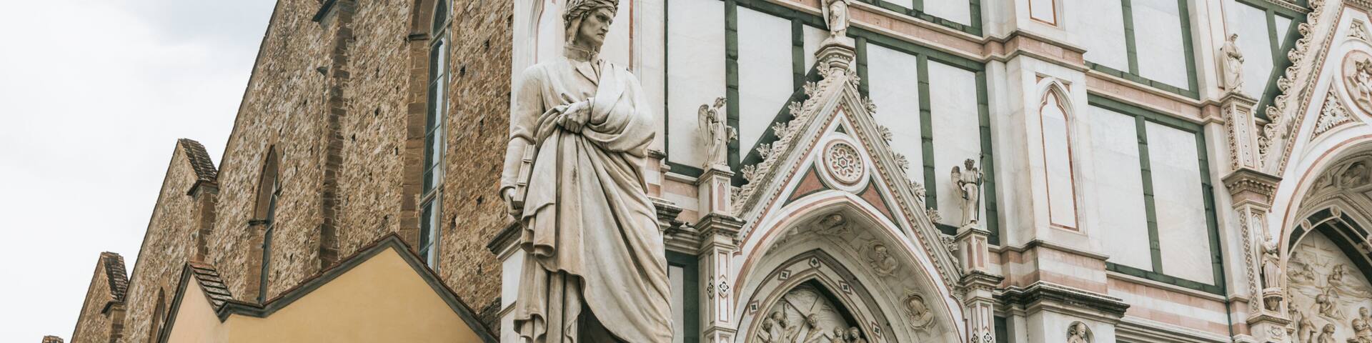 A historic building with intricate architectural details, including statues and ornate carvings.