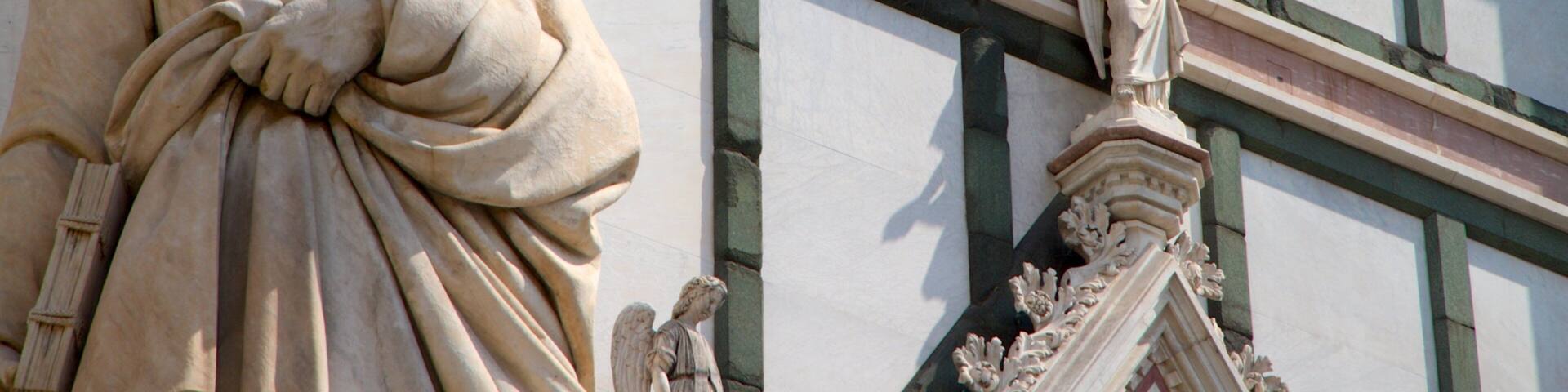 Basilica of Santa Croce showing a statue or sculpture, heritage architecture and religious elements