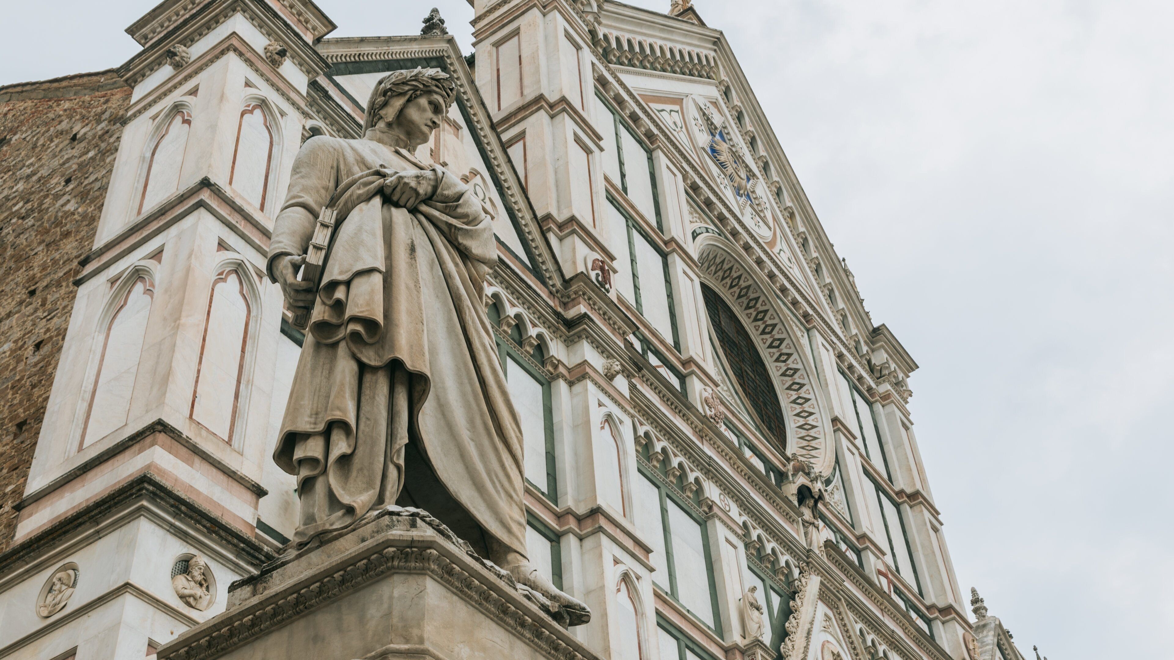 Basilica of Santa Croce showing a statue or sculpture, a church or cathedral and heritage elements