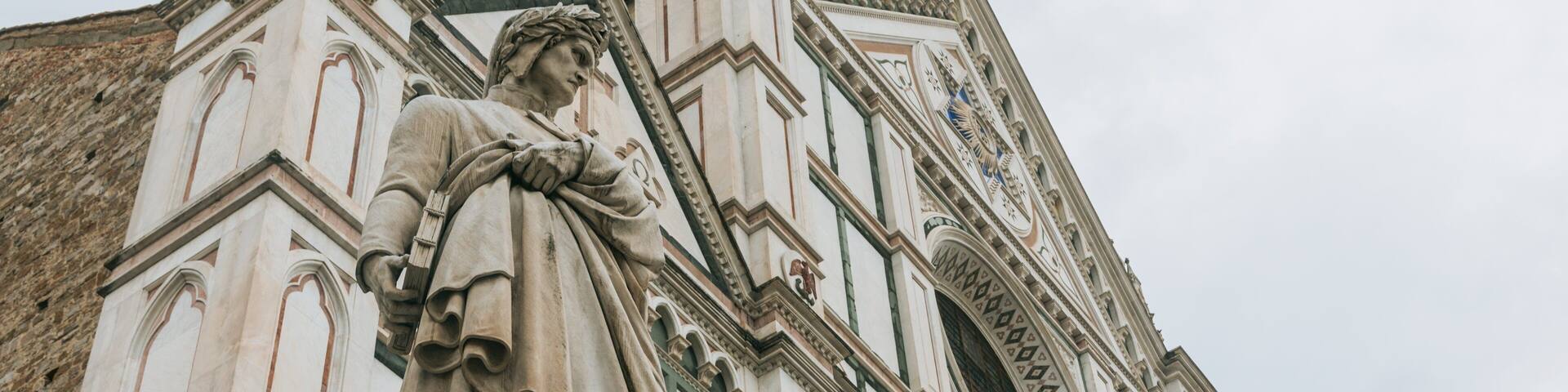 Basilica of Santa Croce showing a statue or sculpture, a church or cathedral and heritage elements