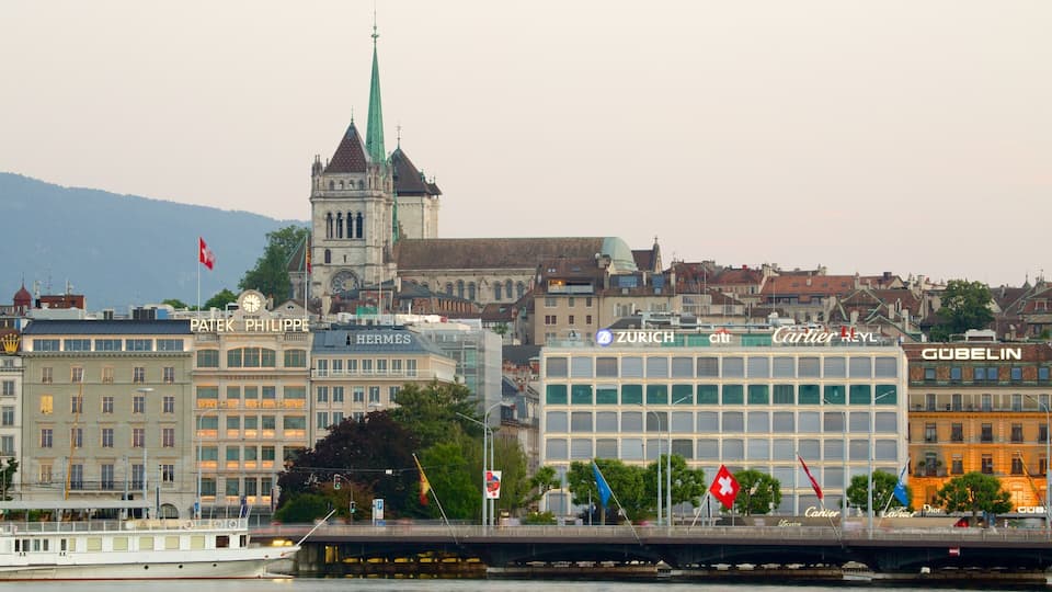 A cityscape with prominent buildings, including a clock tower and a modern glass structure.