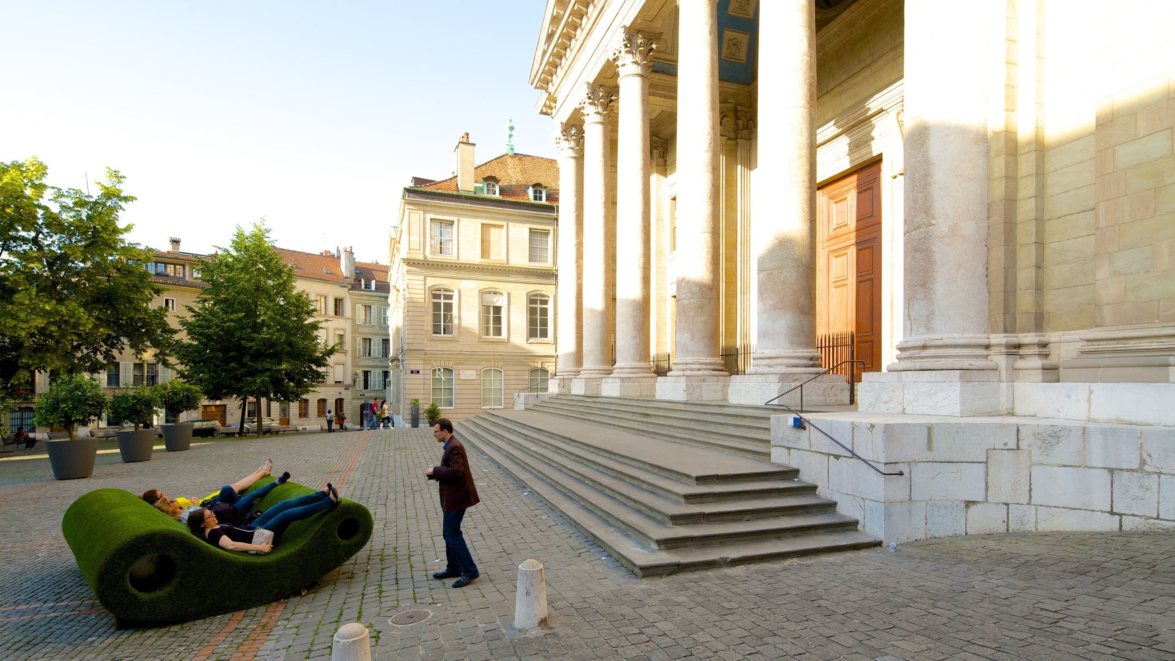 Saint-Pierre Cathedral featuring street scenes as well as a small group of people