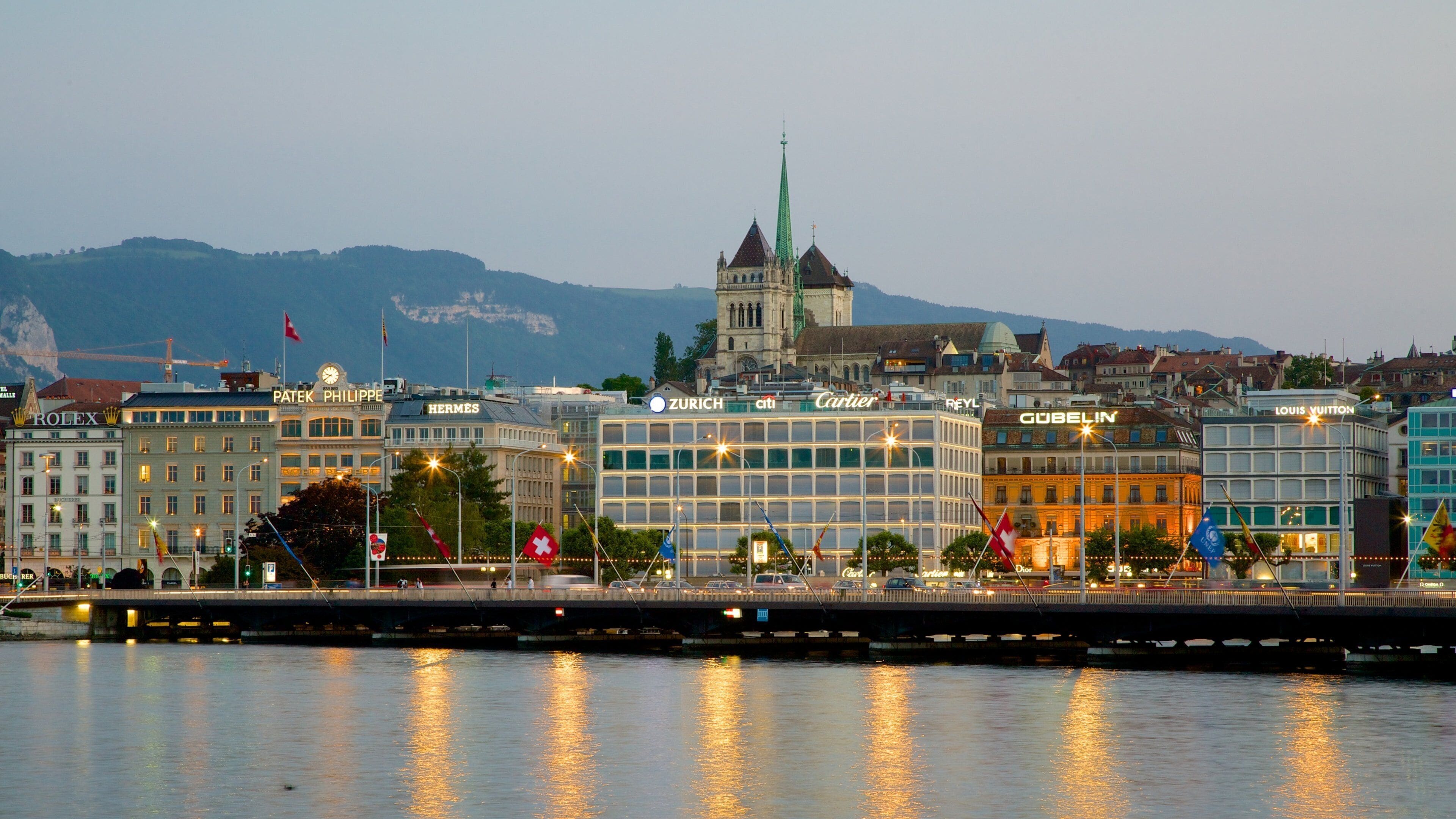 Saint-Pierre Cathedral which includes a lake or waterhole and city views
