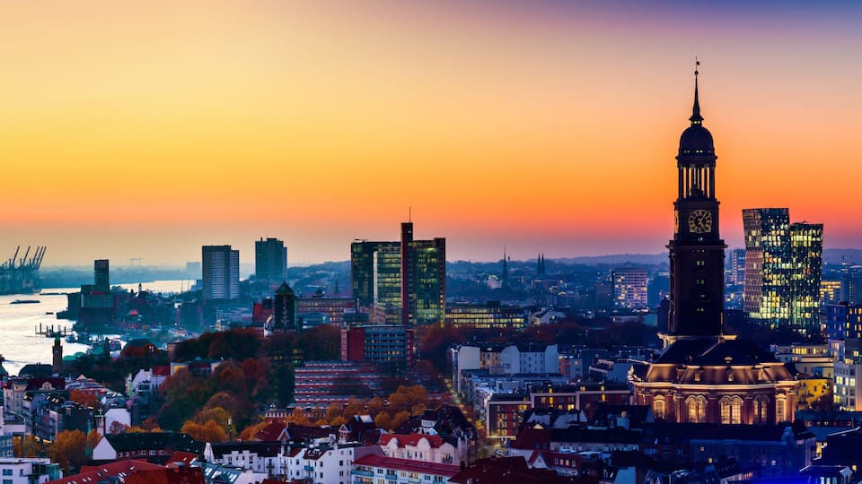 Panoramic aerial view of the harbor, St. Michael's Church (German: St. Michaelis) and downtown Hamburg, Germany.
