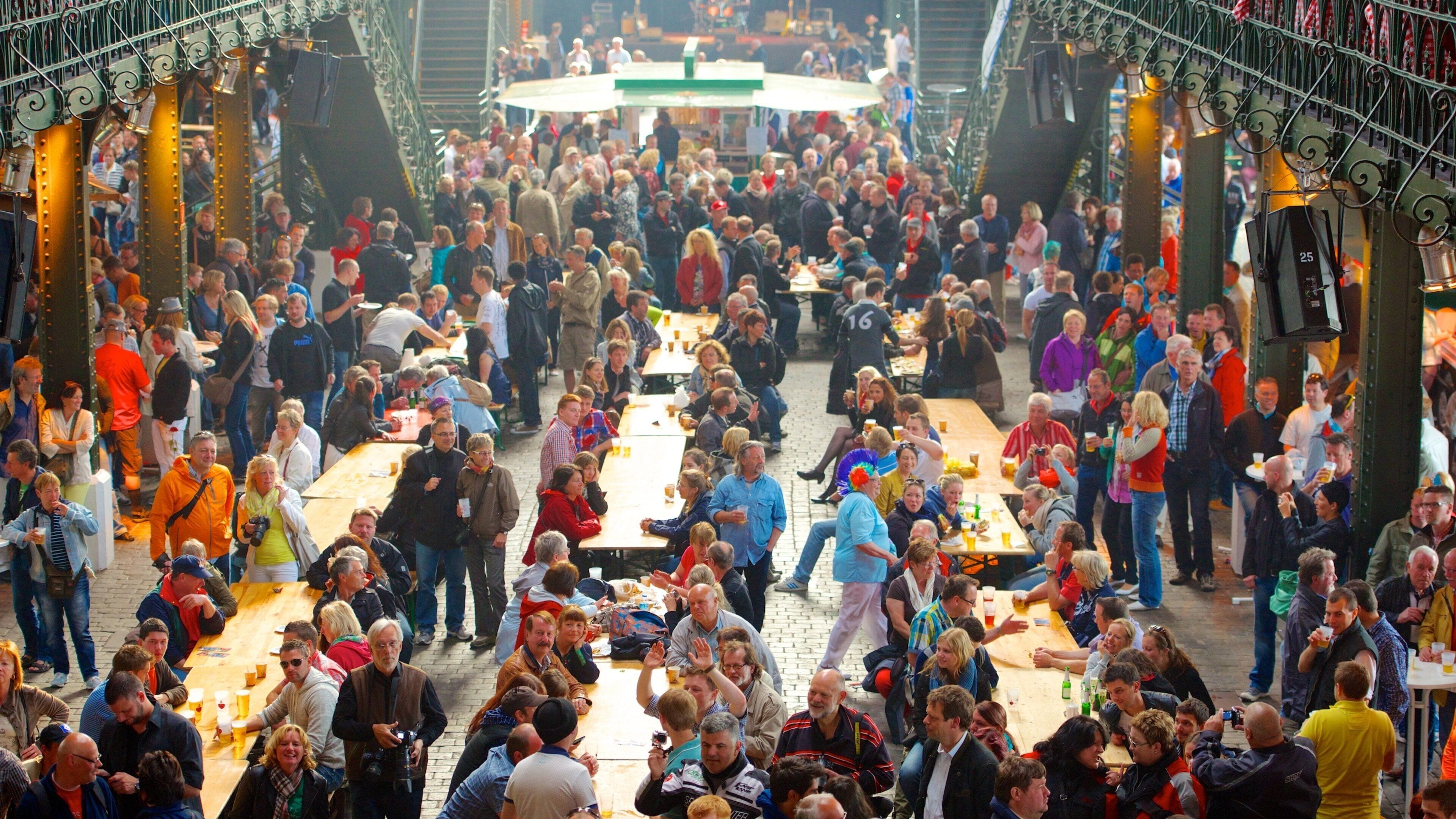 Fish Market featuring markets and interior views as well as a large group of people