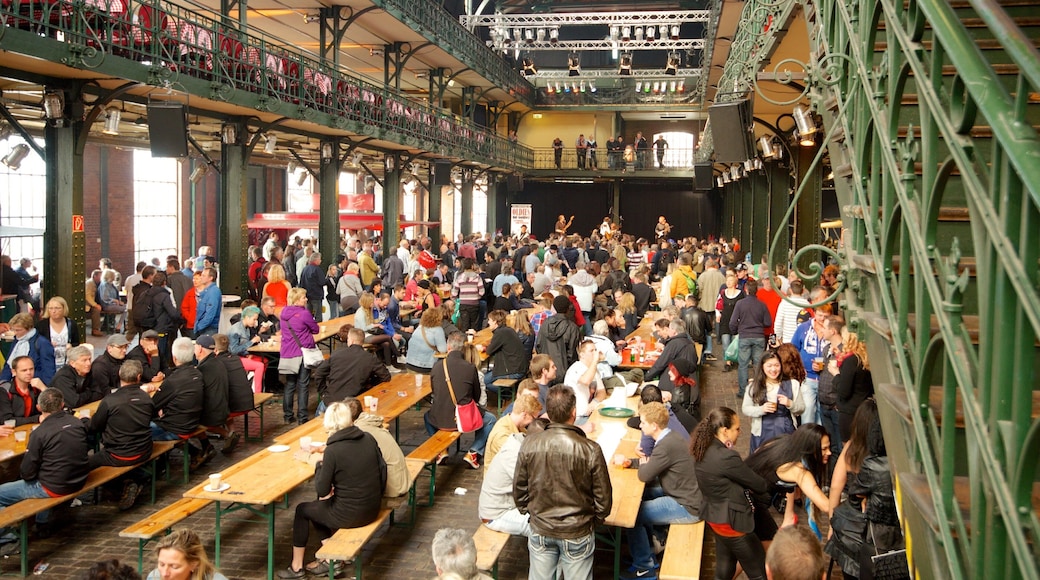 Fish Market which includes interior views and markets as well as a large group of people