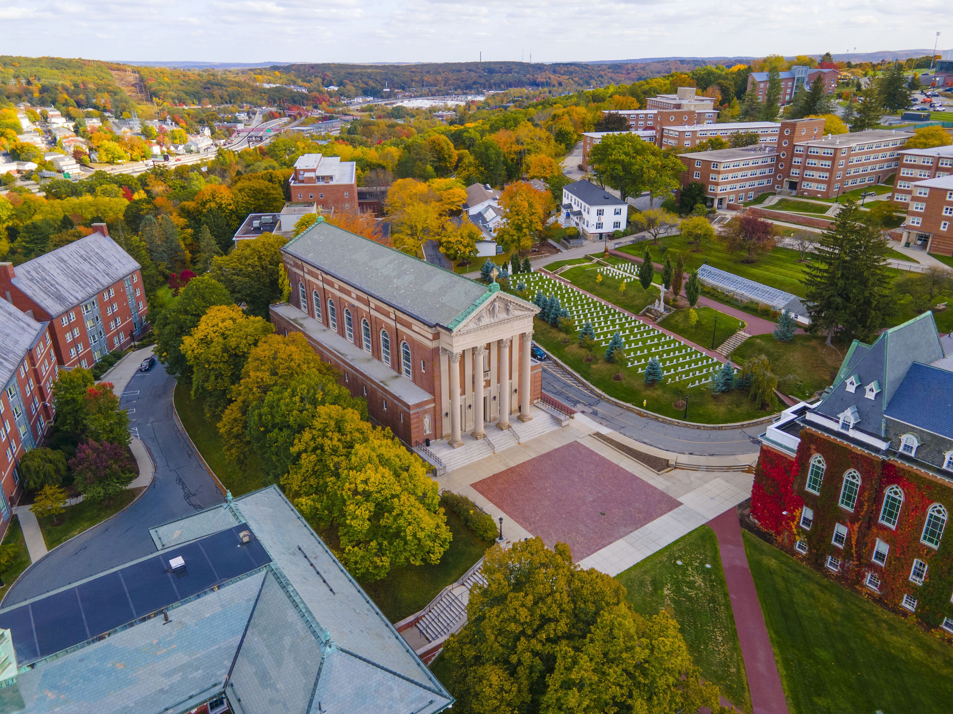 Aerial view of St. Joseph's Chapel in College of the Holy Cross with fall foliage in city of Worcester, Massachusetts MA, USA. 