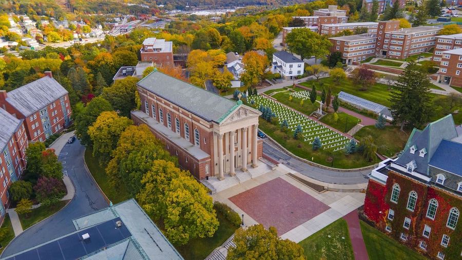 Aerial view of St. Joseph's Chapel in College of the Holy Cross with fall foliage in city of Worcester, Massachusetts MA, USA.