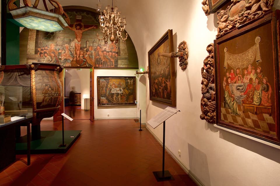 An art gallery with Renaissance paintings and sculptures.