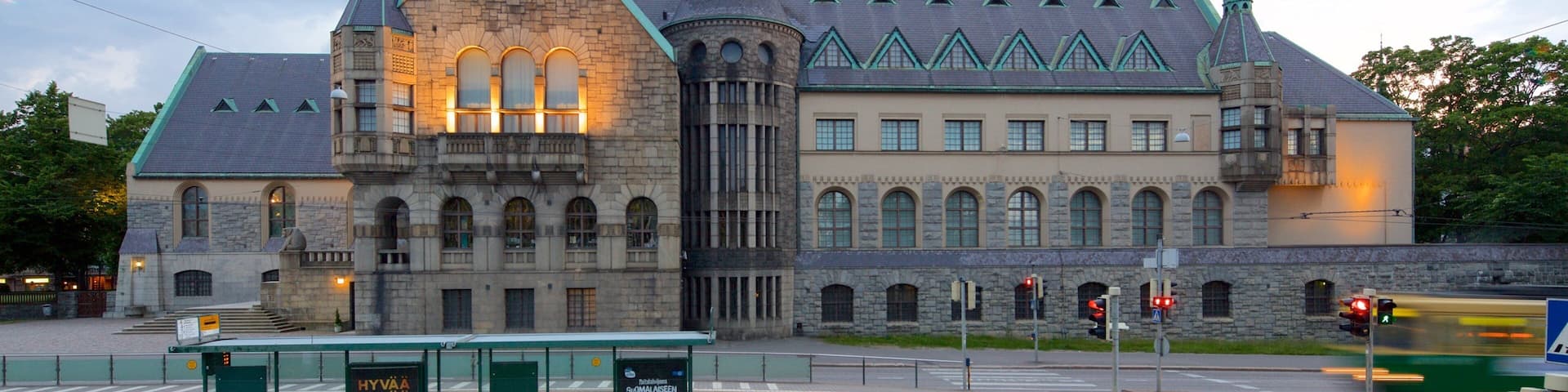A historic building with a prominent tower and multiple spires.