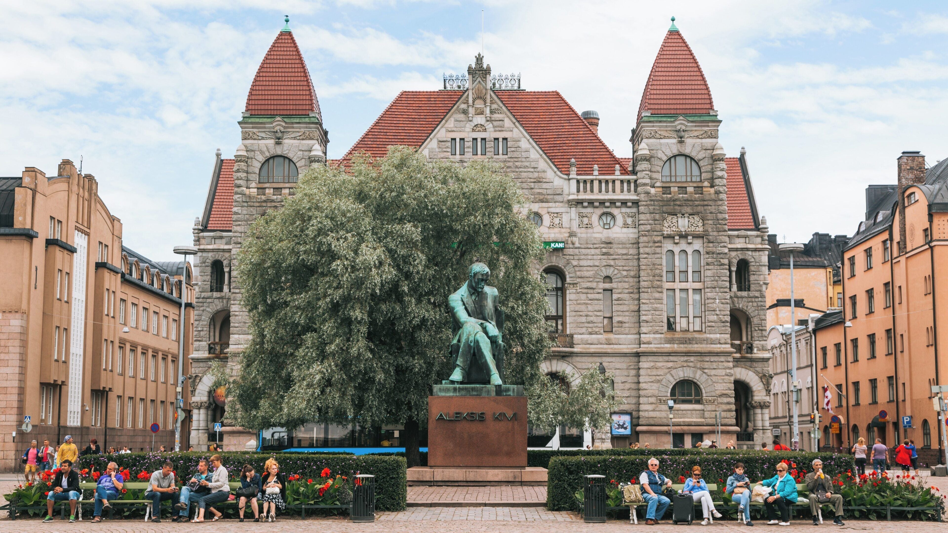 National Theater located in Kluuvi Helsinki showcases its architectural beauty surrounded by vibrant city life