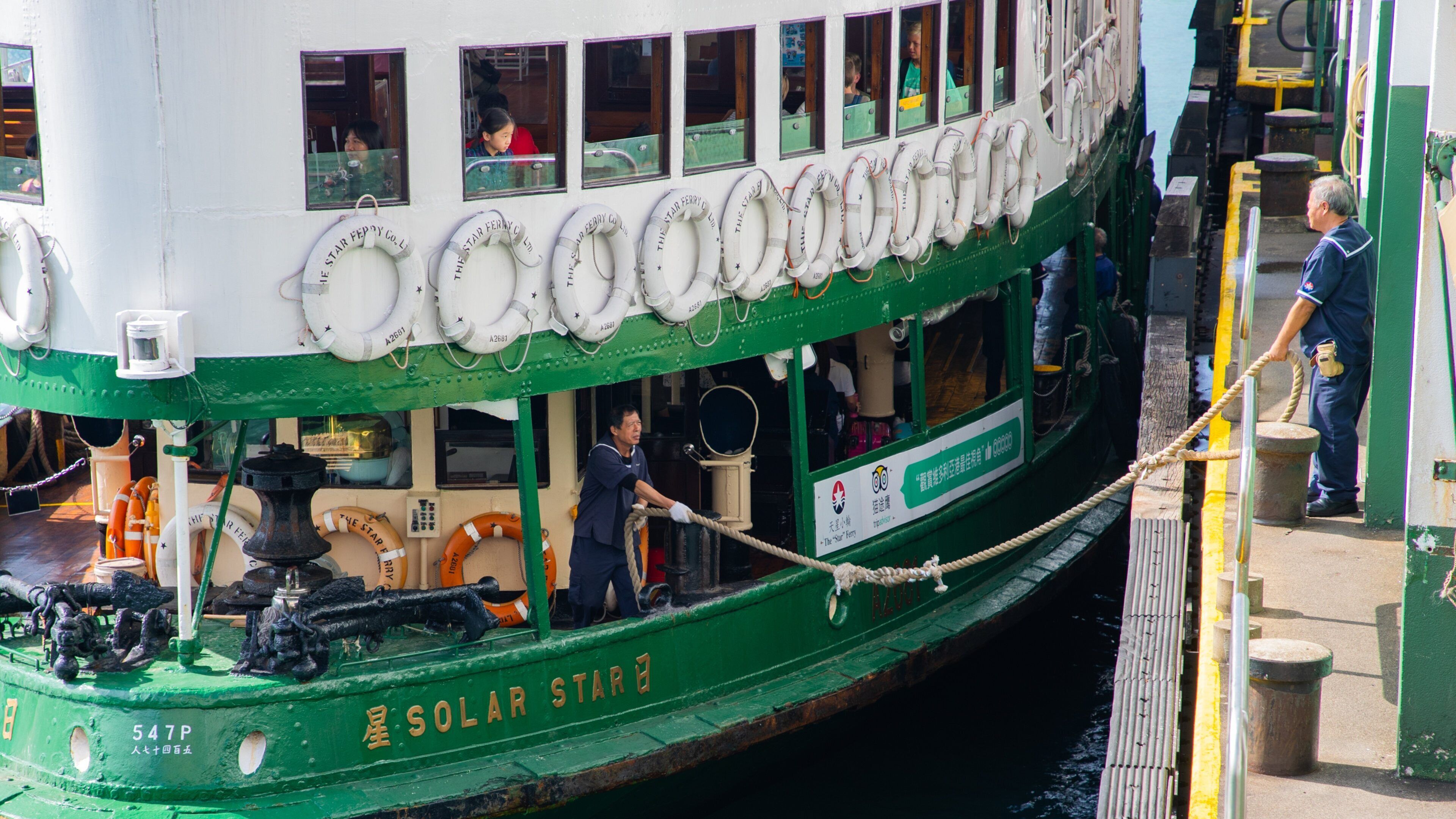 Tsim Sha Tsui Star Ferry Pier which includes a bay or harbor as well as an individual male