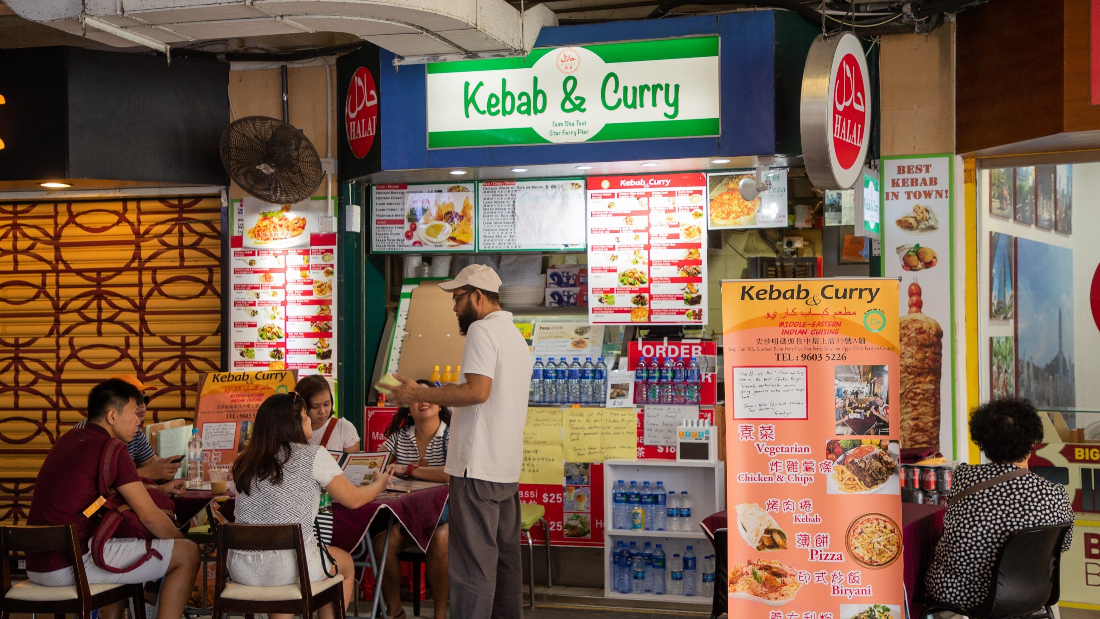 Tsim Sha Tsui Star Ferry Pier showing night scenes, street scenes and outdoor eating