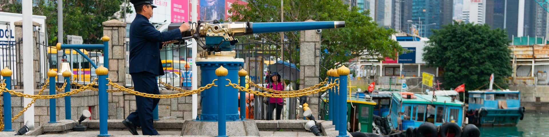 Noon Day Gun showing military items, a bay or harbor and heritage elements