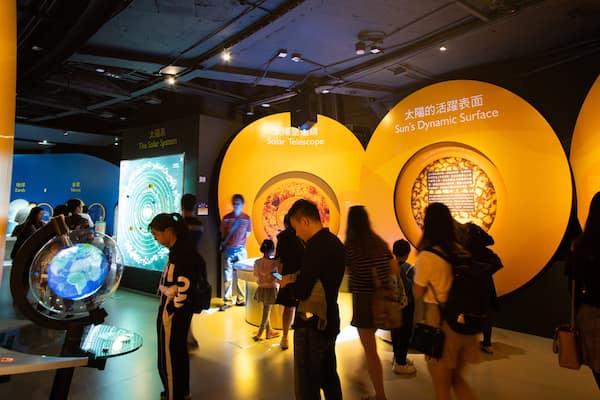 Hong Kong Space Museum which includes interior views as well as a small group of people