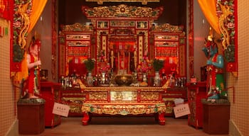 Tin Hau Temple featuring interior views, a temple or place of worship and religious elements