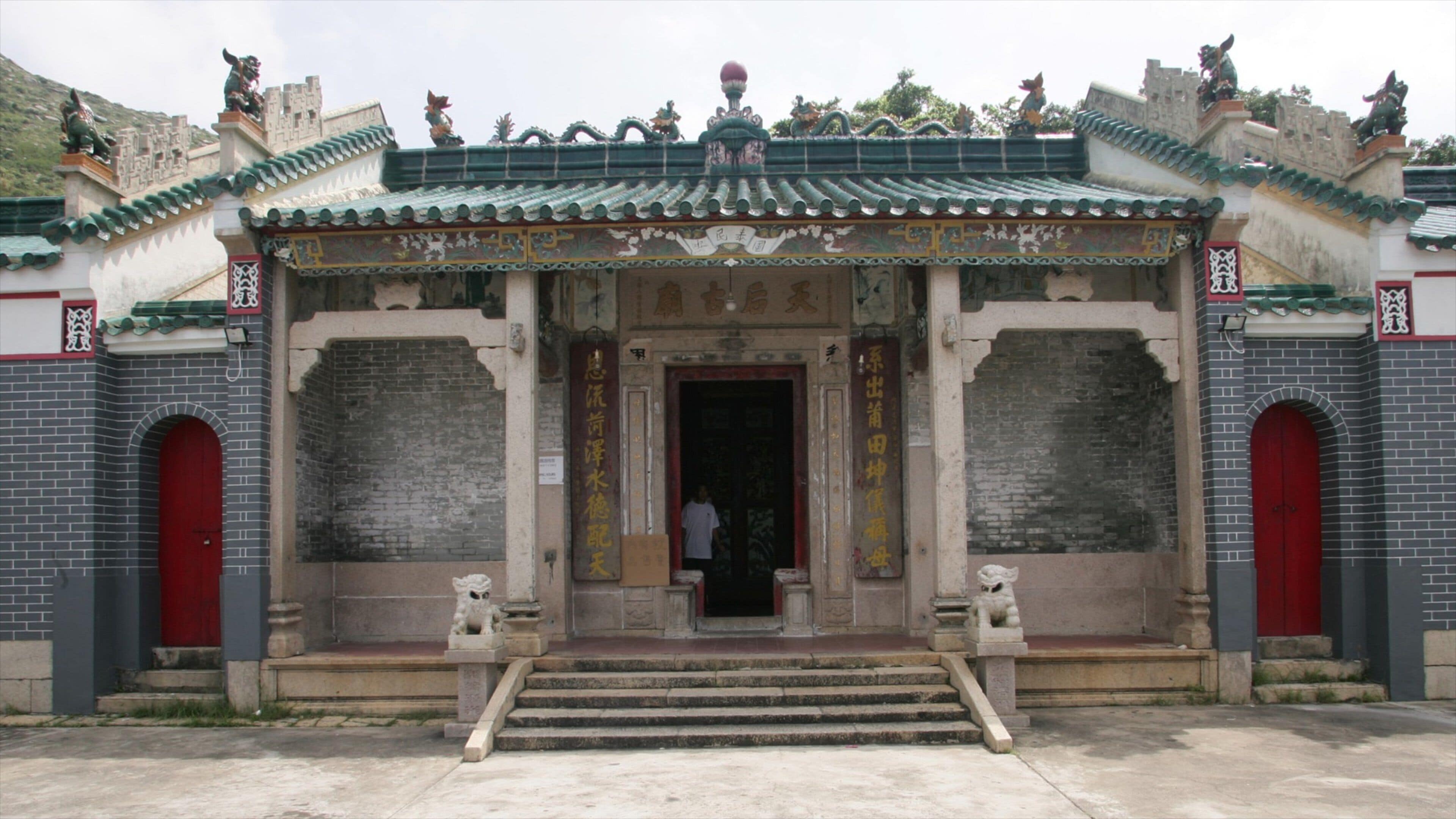 Tin Hau Temple which includes a temple or place of worship and street scenes