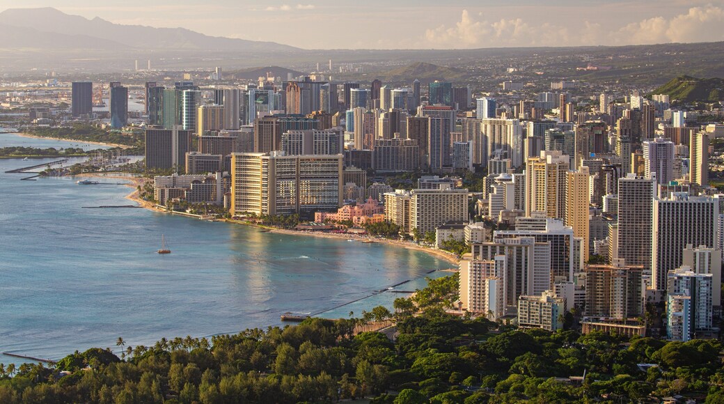 Diamond Head which includes a city, landscape views and a sunset