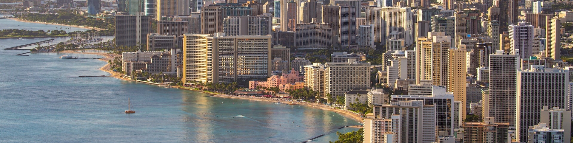 Diamond Head which includes a city, landscape views and a sunset
