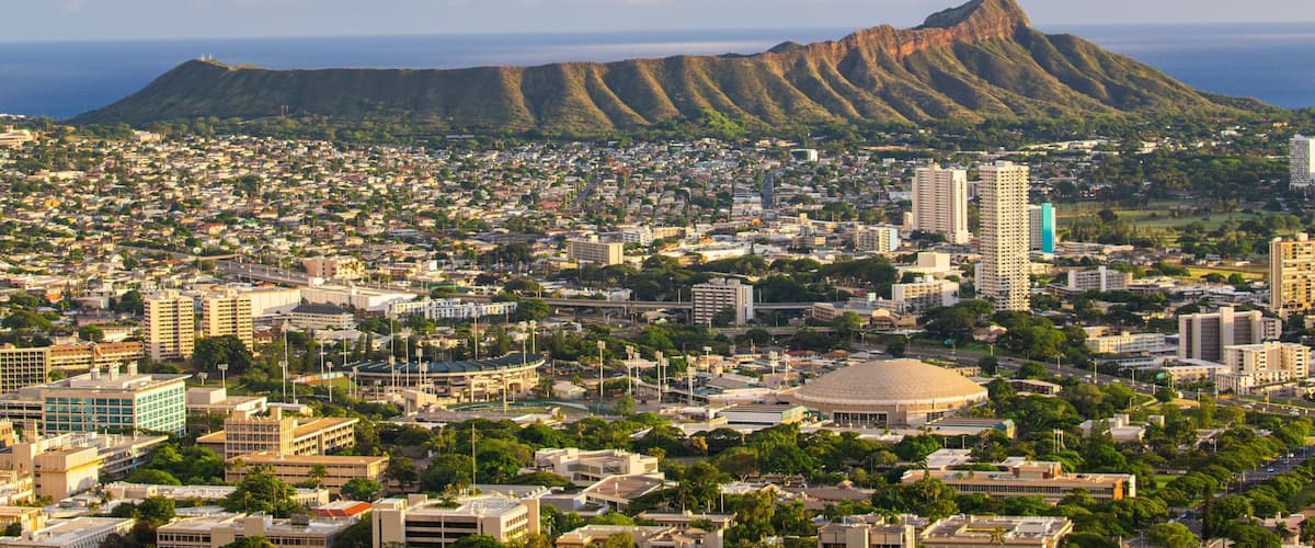 Diamond Head showing mountains, landscape views and a city