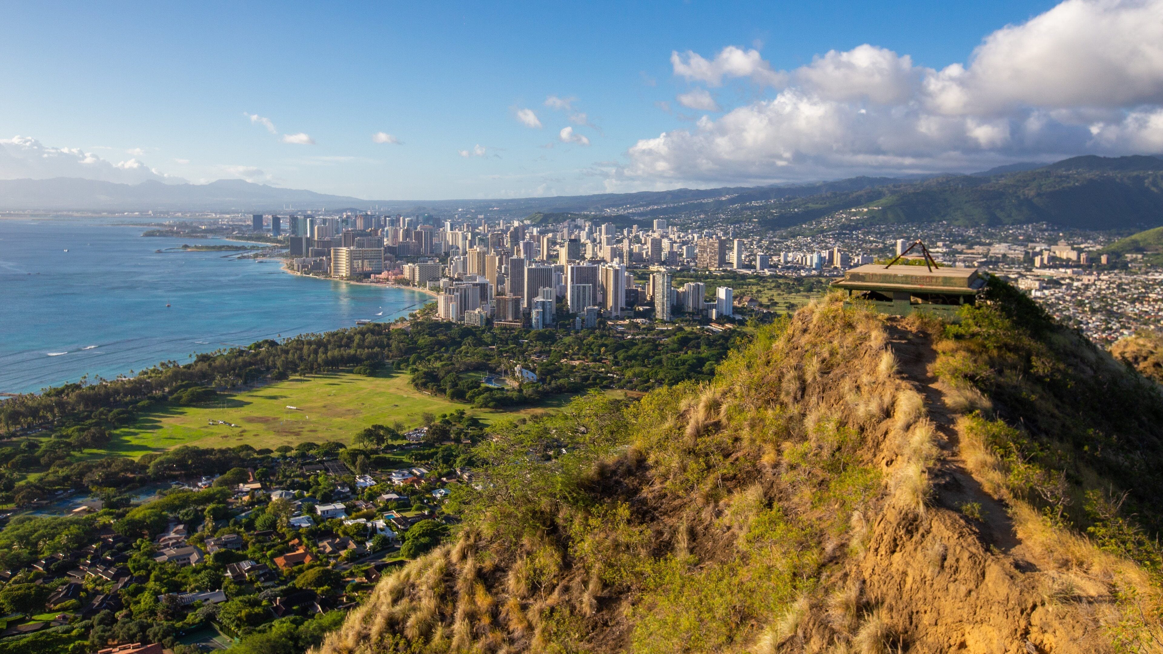Diamond Head featuring a sunset, a city and mountains