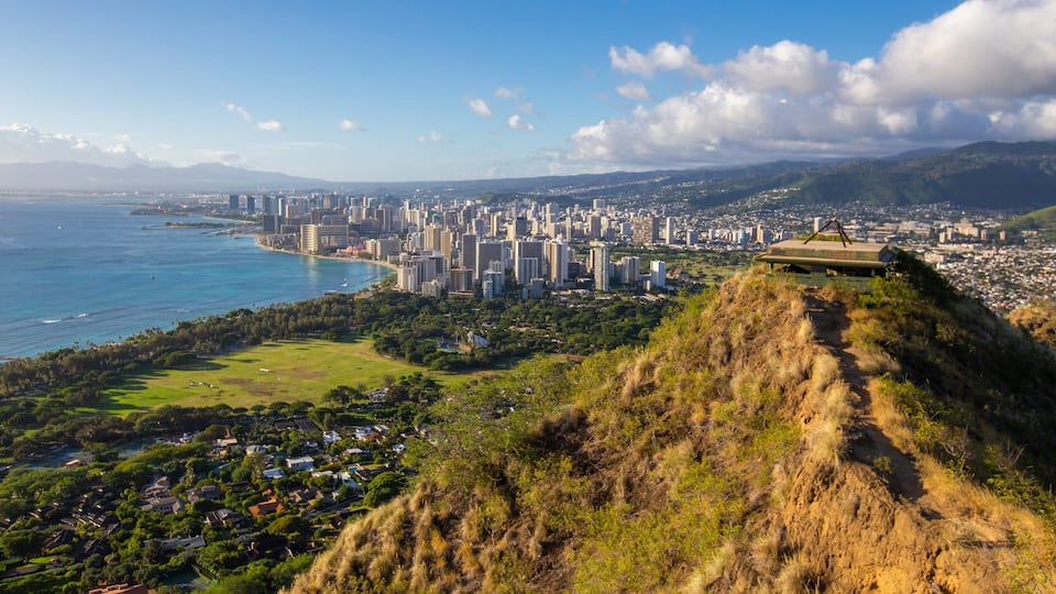 Diamond Head featuring a sunset, a city and mountains