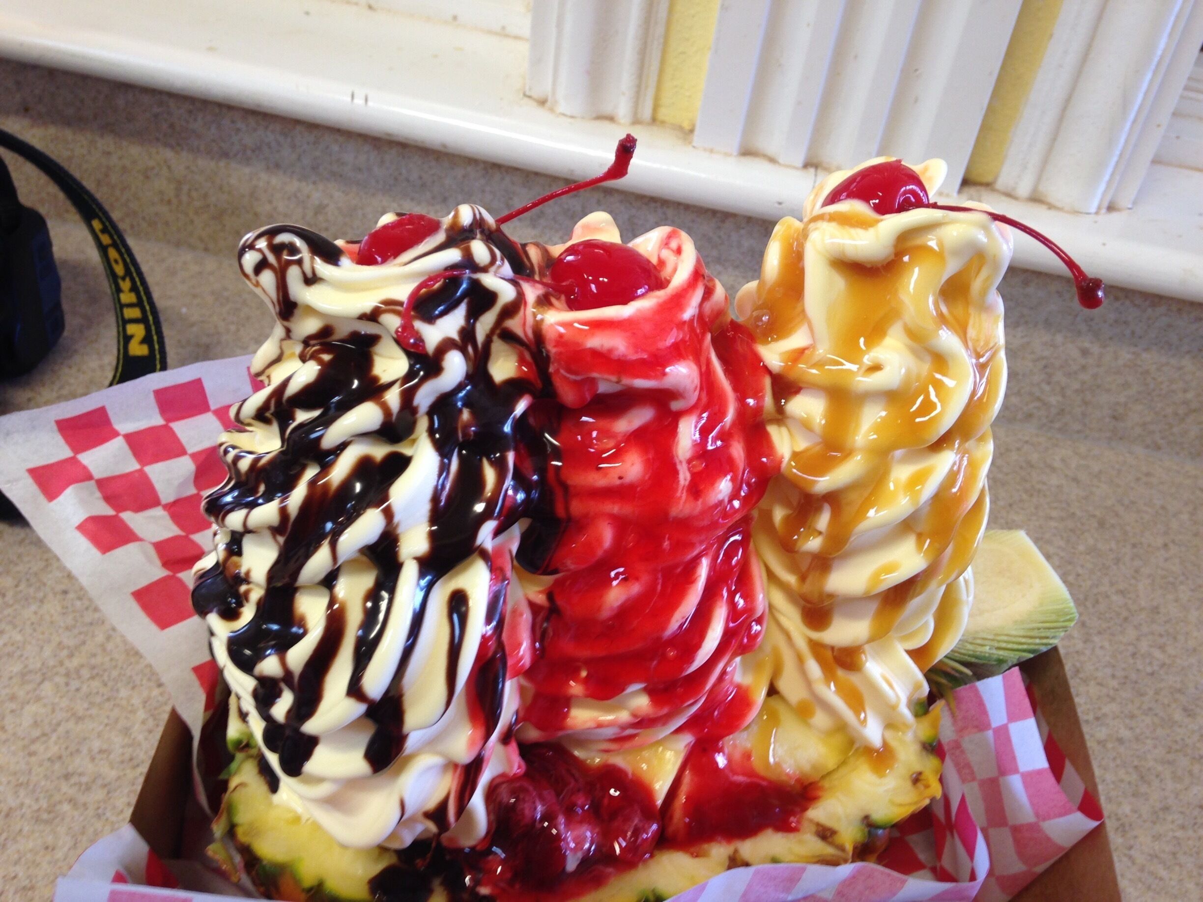 The Pineapple Split! With 3 large mounds of dole whip served to you in half a pineapple! 