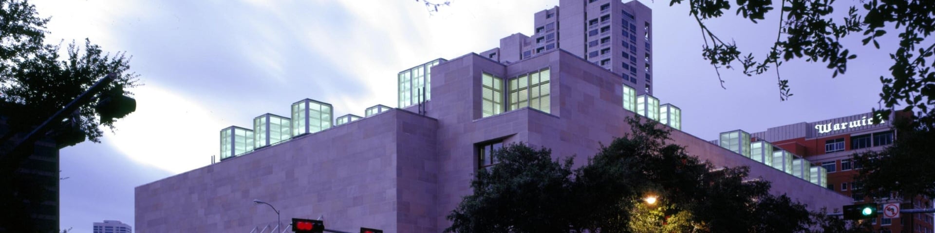 Houston Museum of Fine Arts showcases modern architecture in urban setting at dusk
