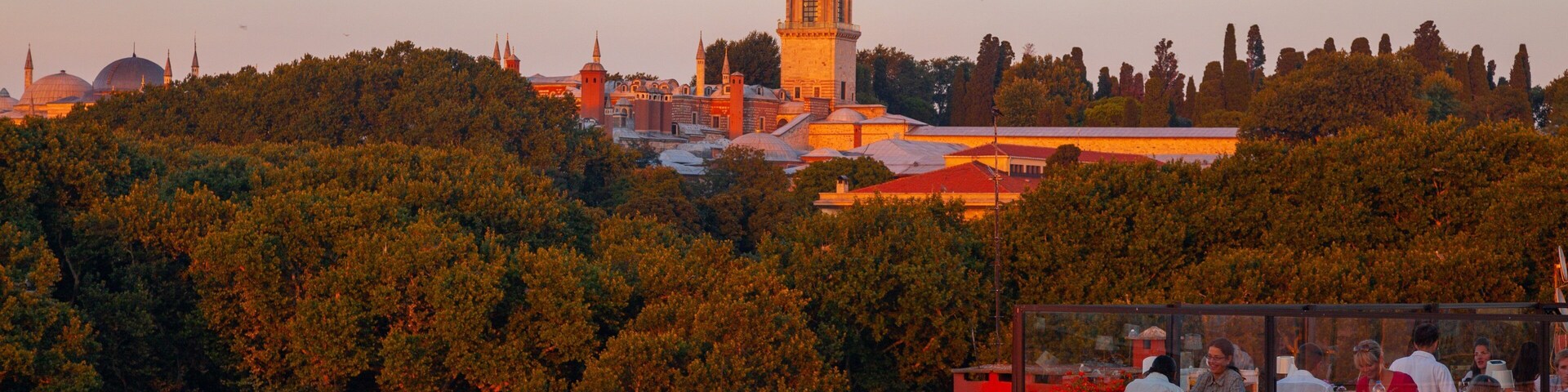 Topkapi Palace featuring outdoor eating, landscape views and a sunset