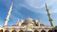 A mosque with multiple domes and minarets.
