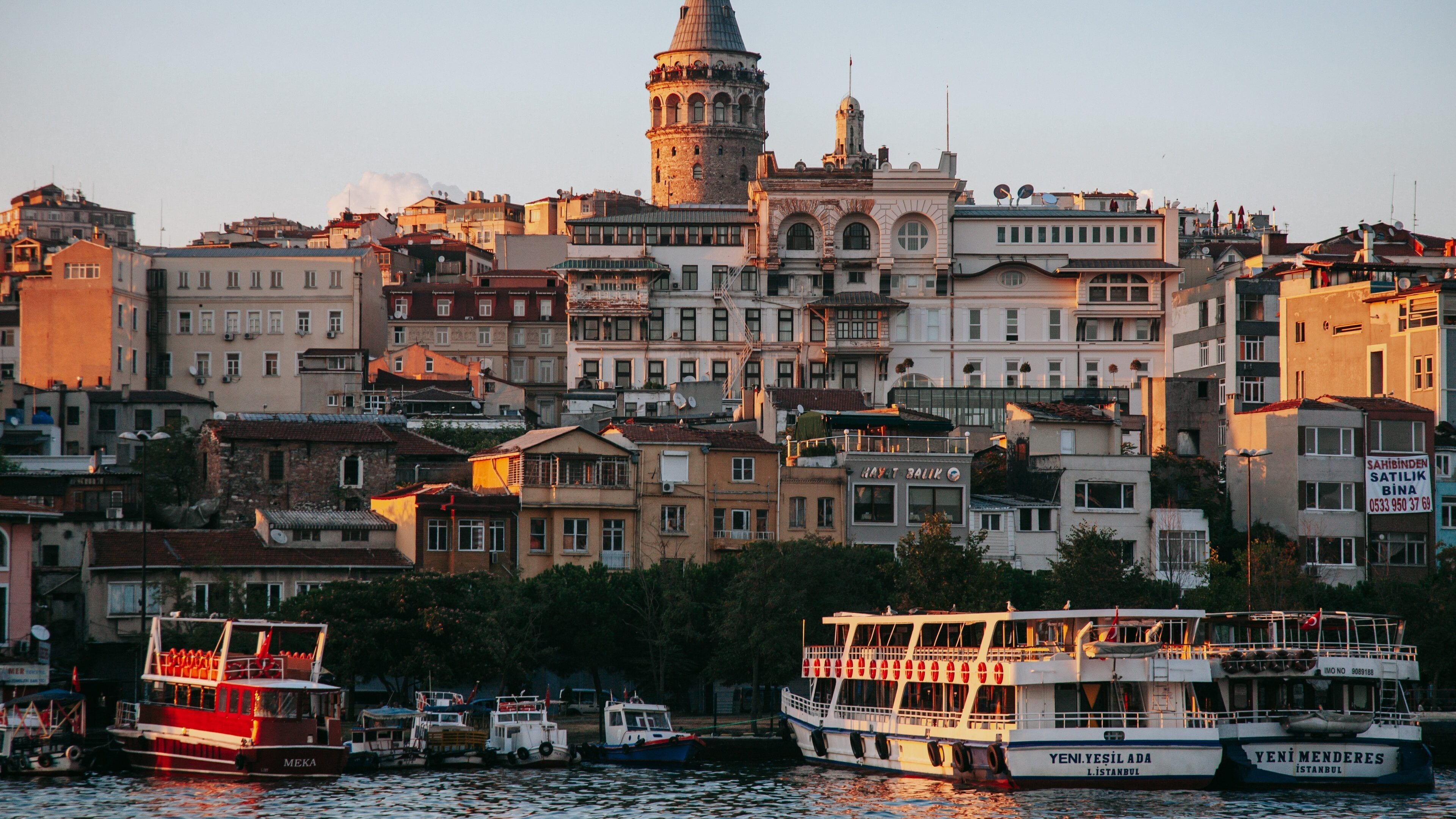Galata Tower showing a bay or harbor and a sunset