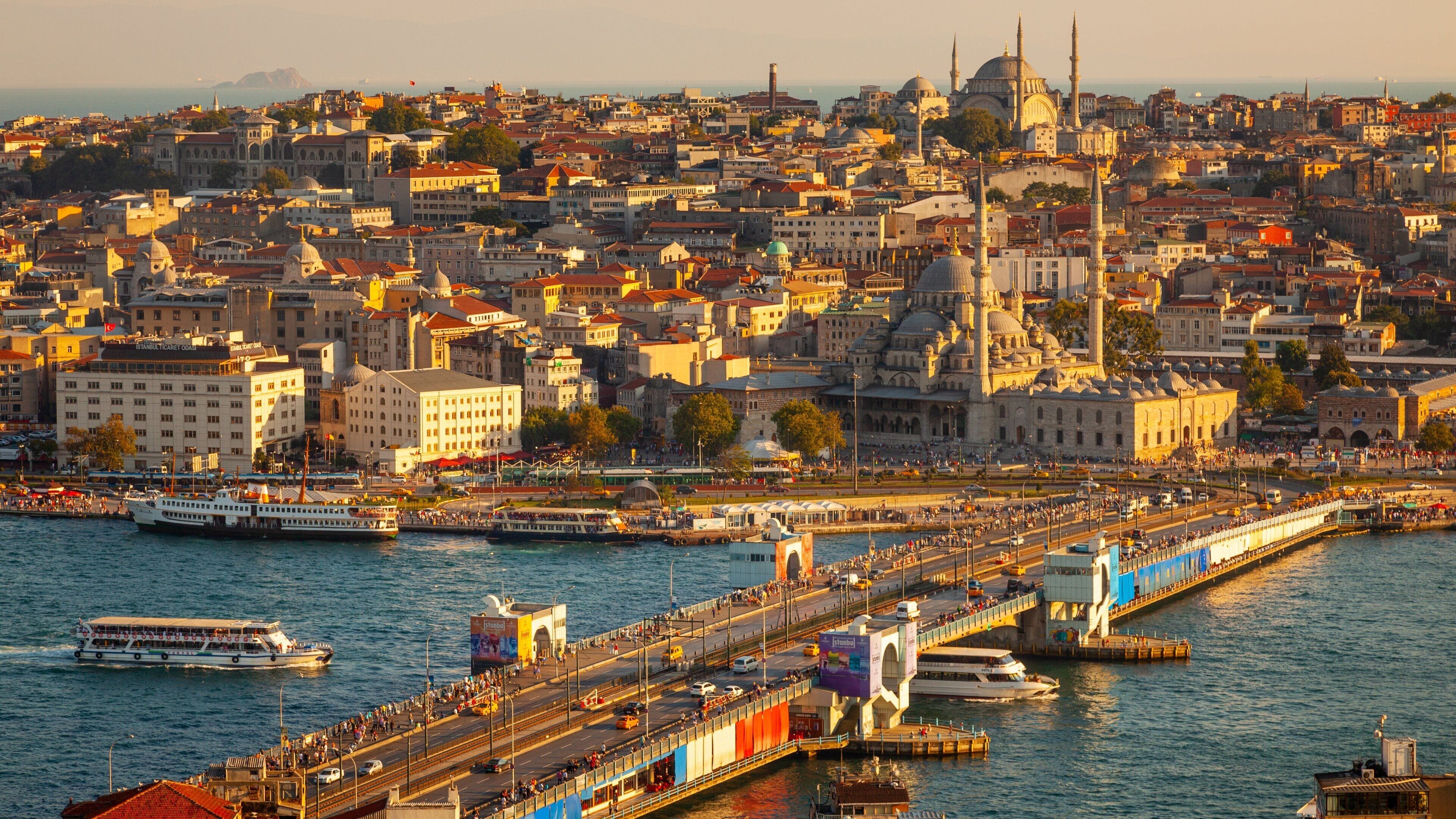 Galata Tower featuring a ferry, skyline and a river or creek
