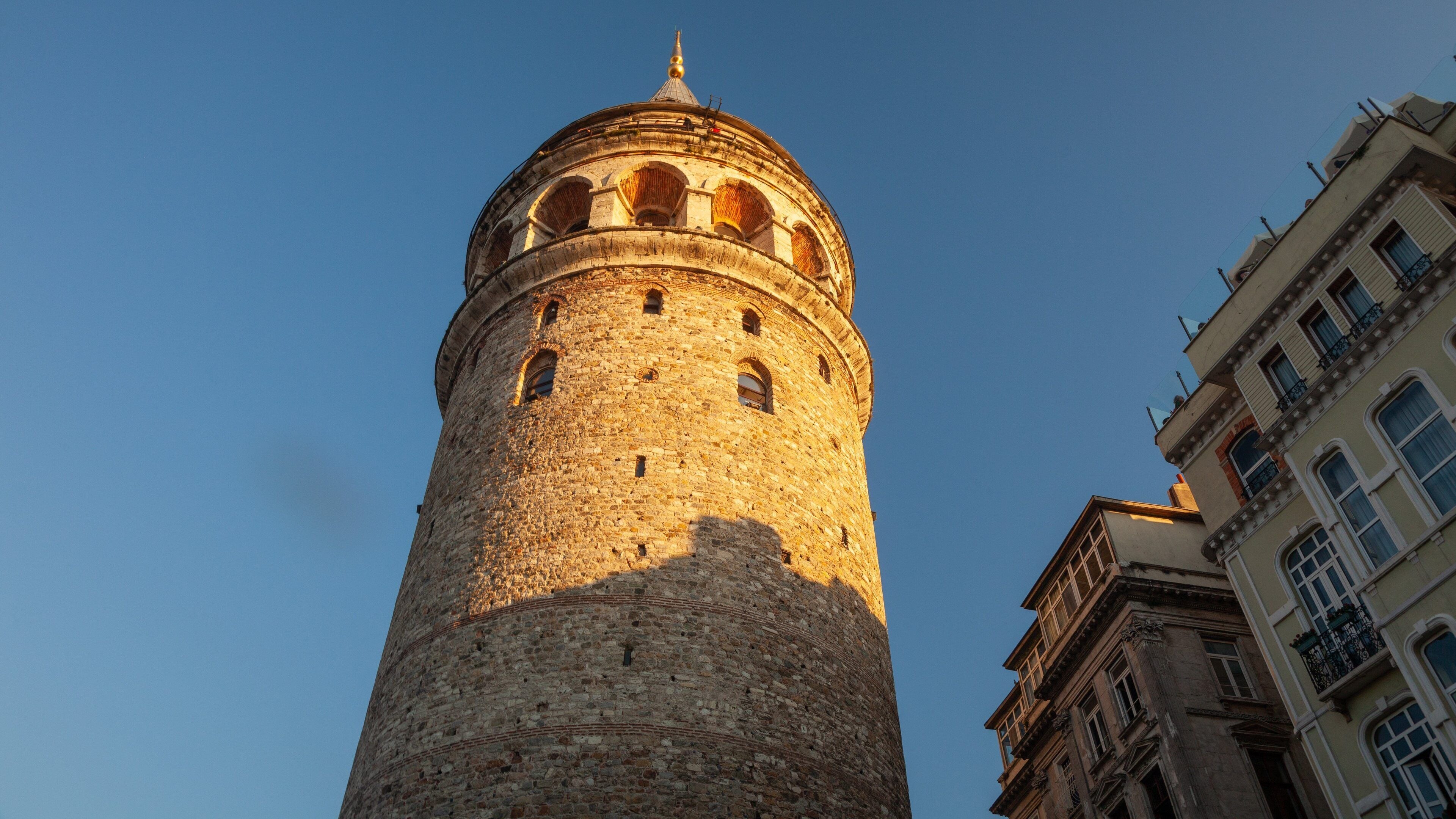 Galata Tower featuring a sunset and heritage architecture