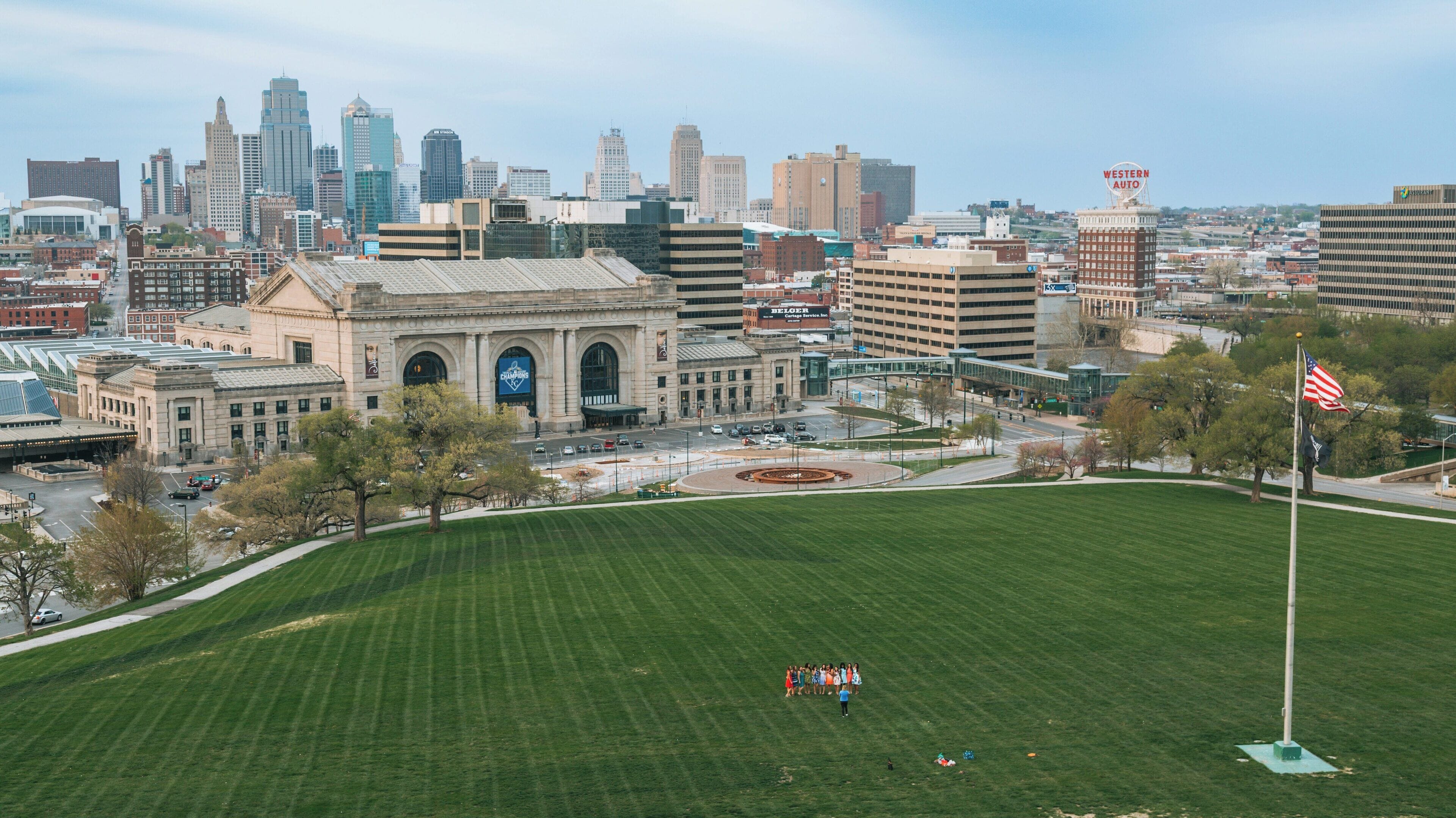 Liberty Memorial overlooks Crown Center District in Kansas City, Missouri with a view of the skyline and community activities on the lawn