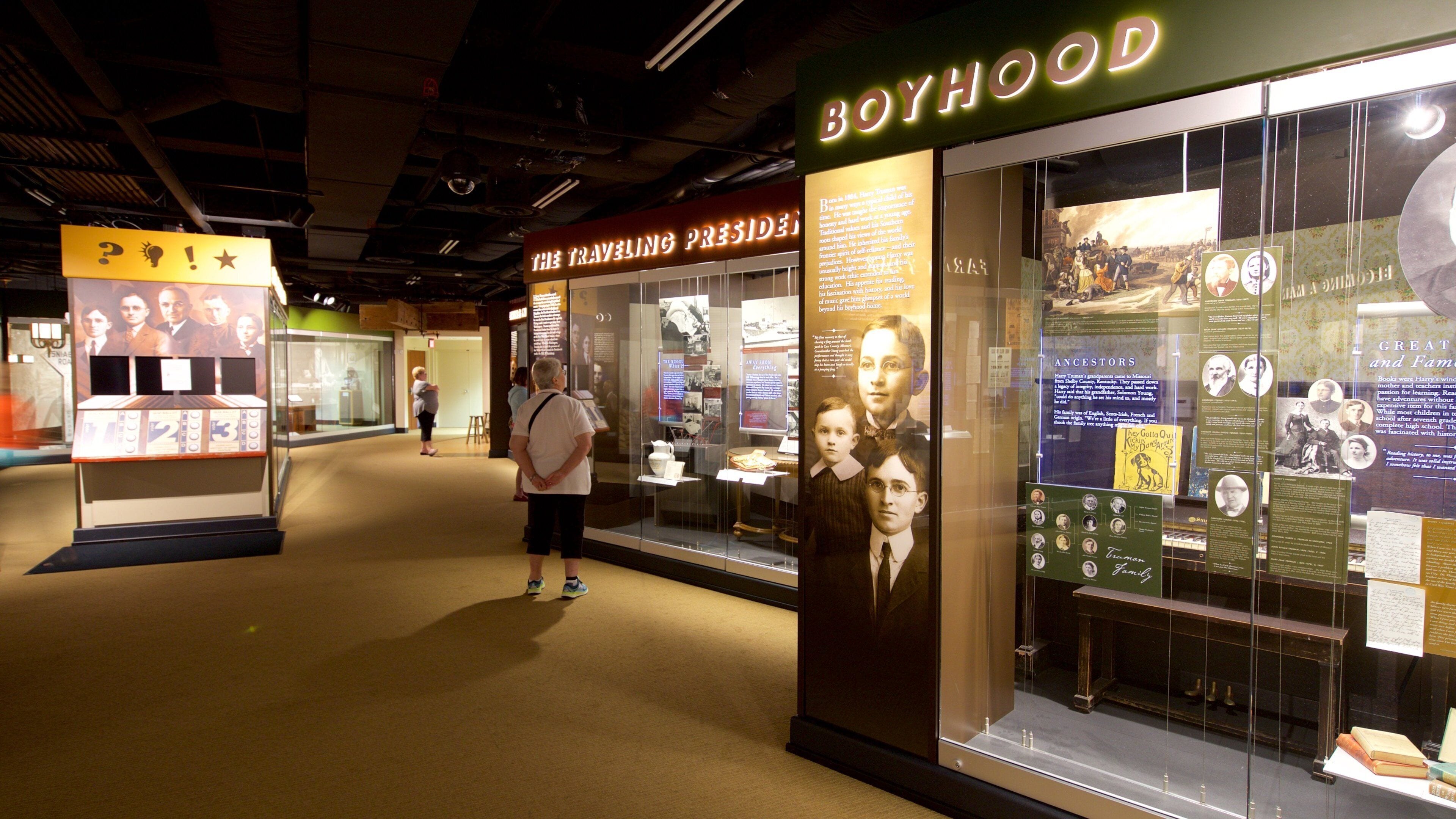 An exhibit with displays about the Boyhood Museum, including historical artifacts and information panels.
