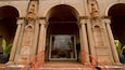 The Kauai Museum entrance with classical architecture, including arches and columns.