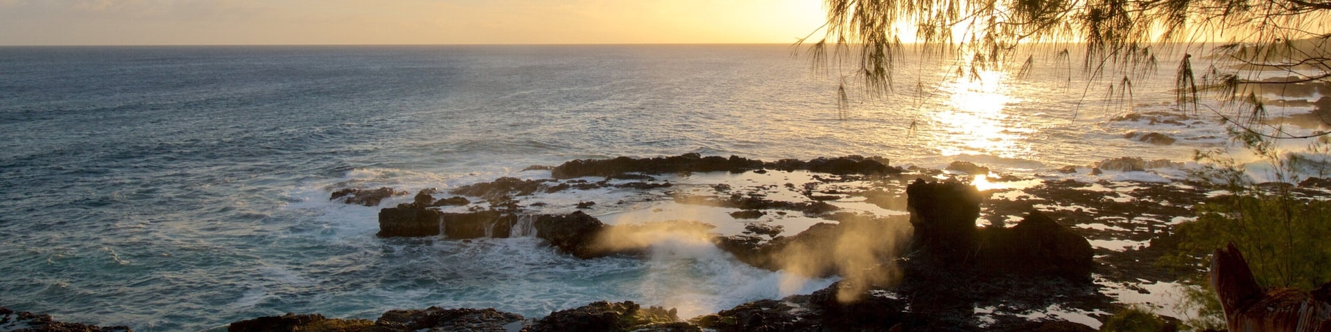 Spouting Horn which includes a pebble beach and a sunset