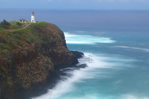 Kilauea Lighthouse featuring a lighthouse, general coastal views and a gorge or canyon