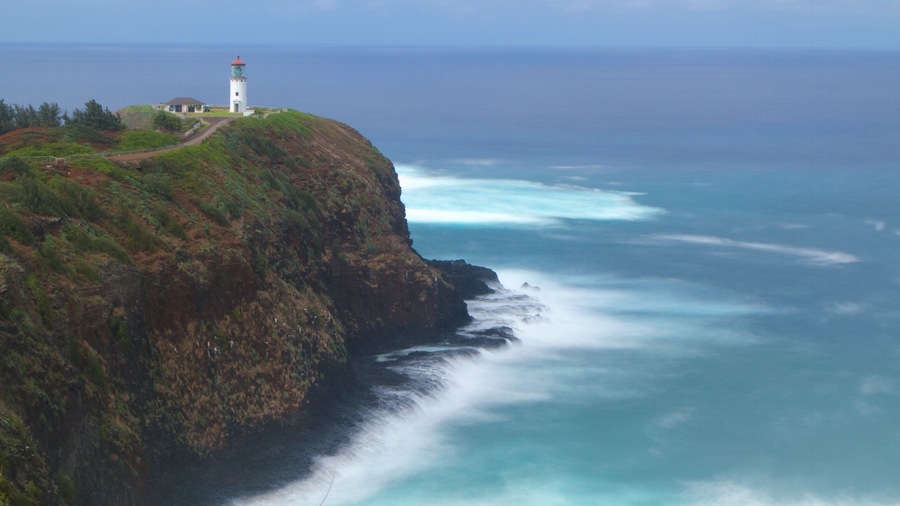 Kilauea Lighthouse featuring a lighthouse, general coastal views and a gorge or canyon