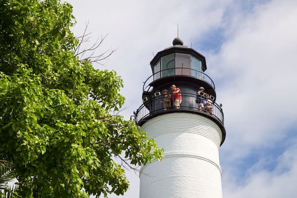 Key West Lighthouse and Keeper\'s Quarters Museum which includes a lighthouse as well as a small group of people