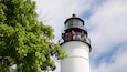 Key West Lighthouse and Keeper\'s Quarters Museum which includes a lighthouse as well as a small group of people