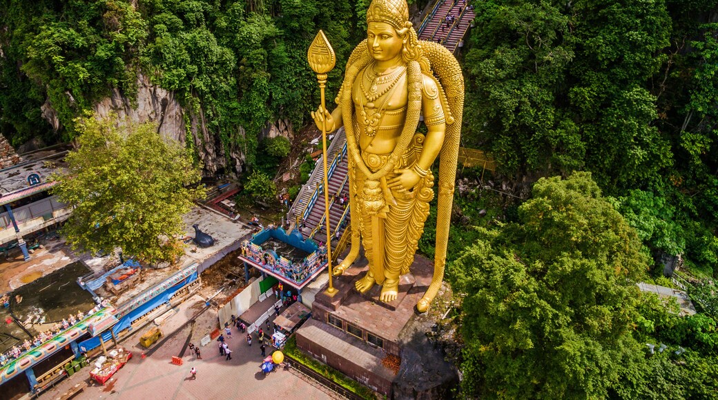 Batu Caves near Kuala Lumpur, Malaysia, aerial view of Lord Murugan Statue and entrance to the famous cave temples.
