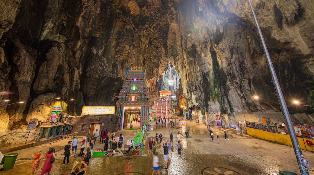Batu Caves which includes caves as well as a large group of people