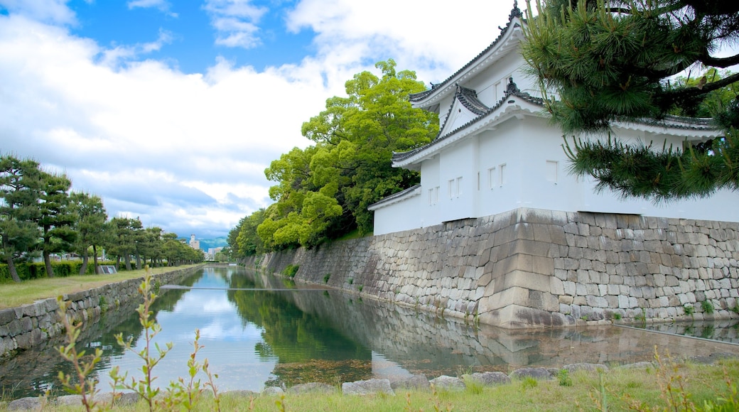 Nijo Castle which includes a river or creek, a small town or village and a garden